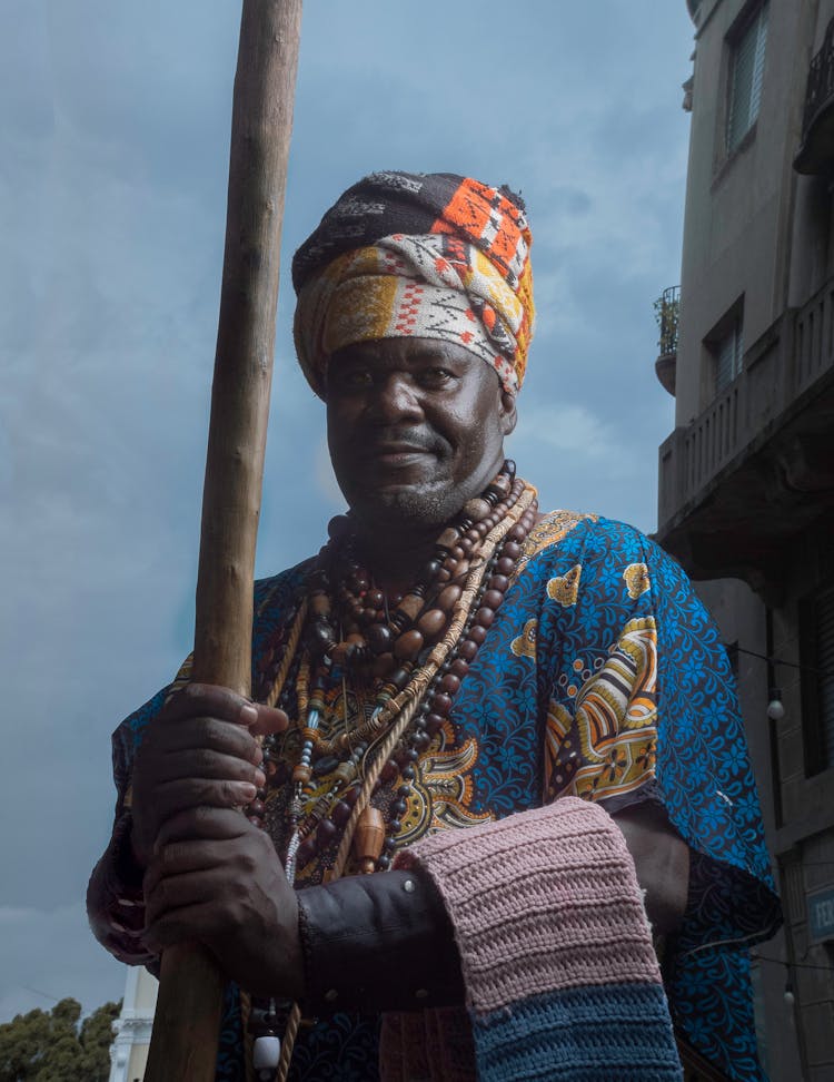 Man Holding A Stick 