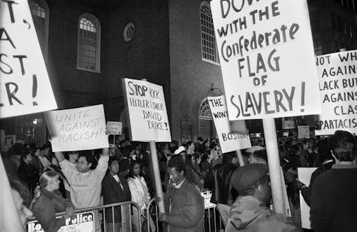 Grayscale Photo of People Protesting