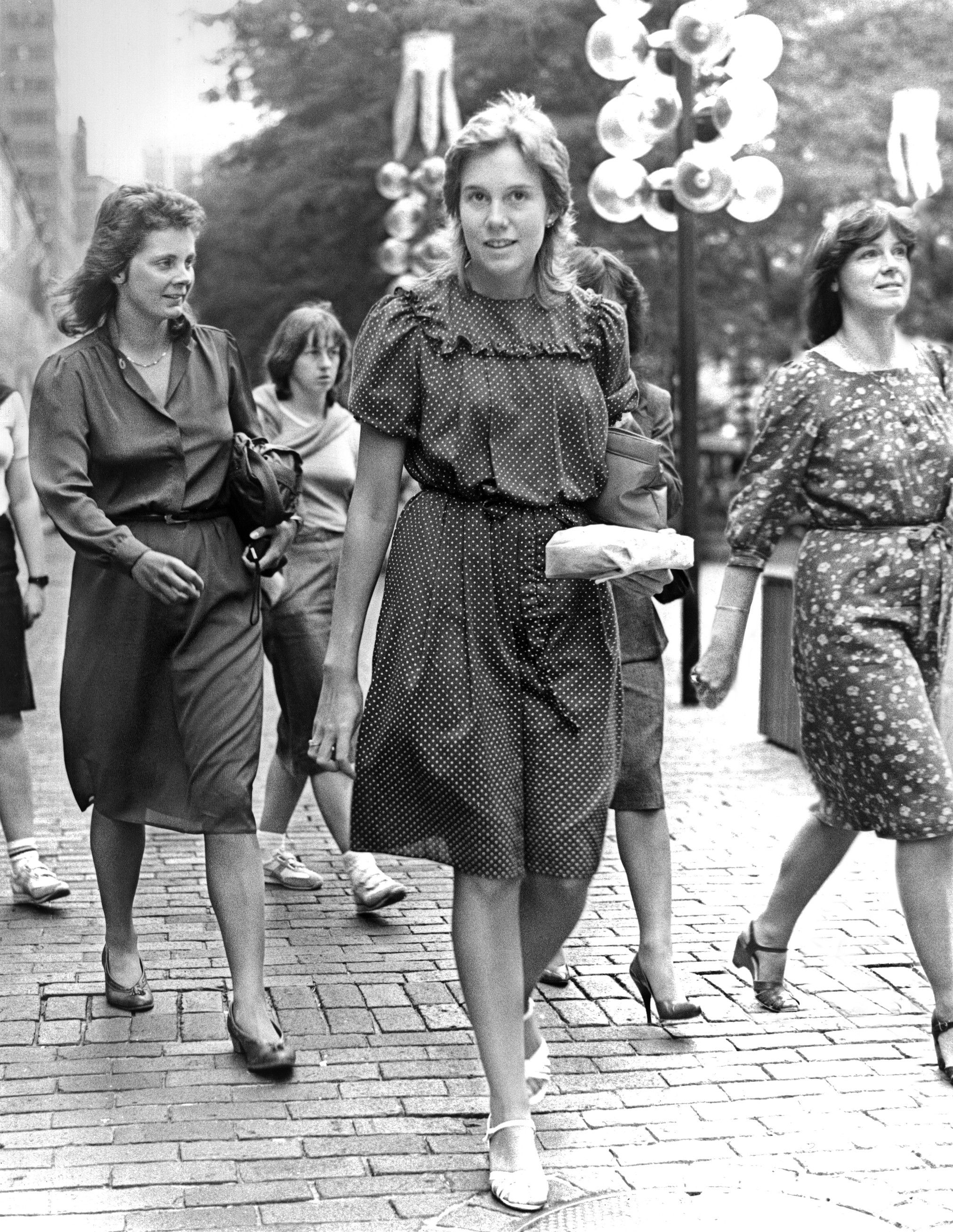 A Grayscale of Women Walking on a Sidewalk · Free Stock Photo