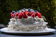 White Cake With Red Raspberry on Top