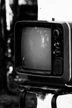 Retro analog television in monochrome setting evocative of vintage style.
