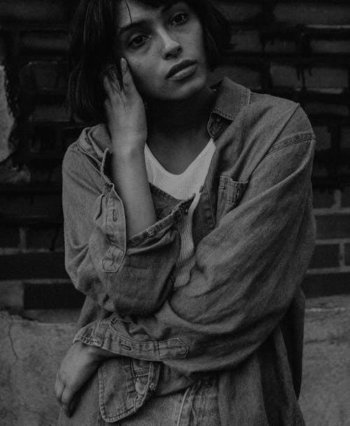 Grayscale Photo of Woman in Denim Jacket