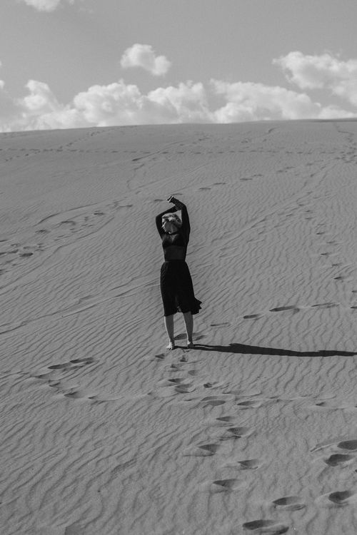 Woman Dancing in Desert Sand Dunes · Free Stock Photo