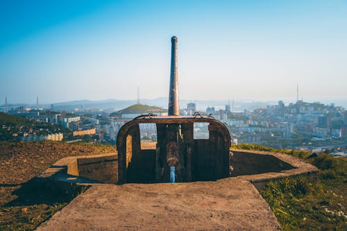 A Rusted Artillery Facing the City