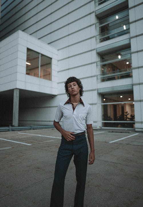 Man in White Polo Shirt and Trousers