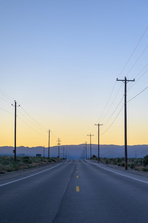 Free Empty Country Road during Dusk  Stock Photo