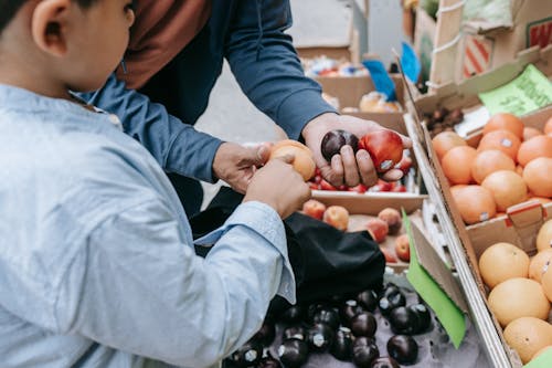 People Buying Fruits at Street Market