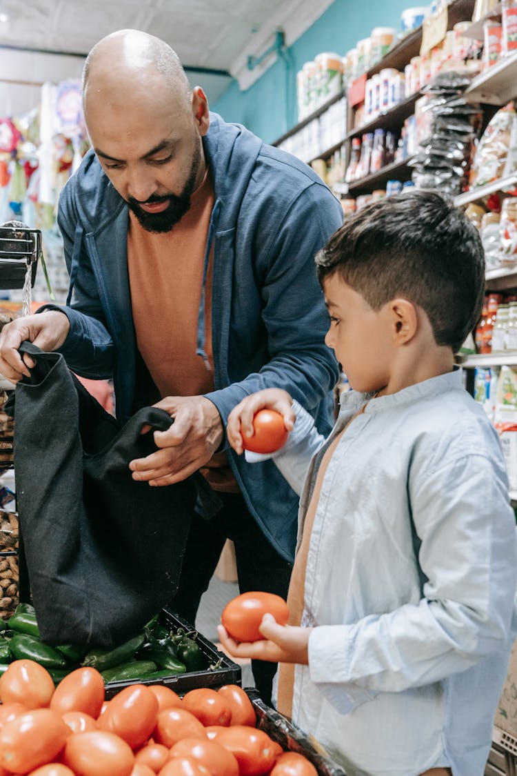 Father And Son Shopping In The Store