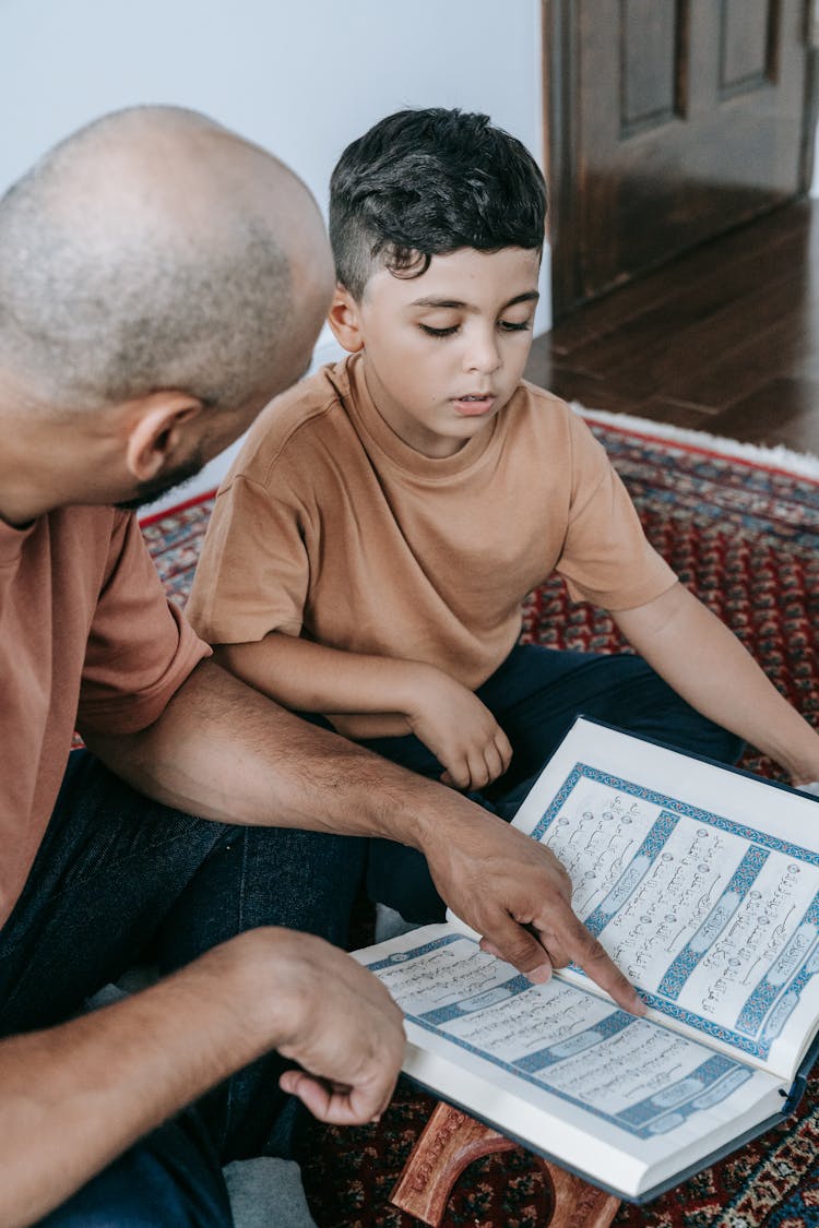 Father And Son Reading Koran