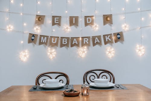 White Ceramic Plates on Brown Wooden Table