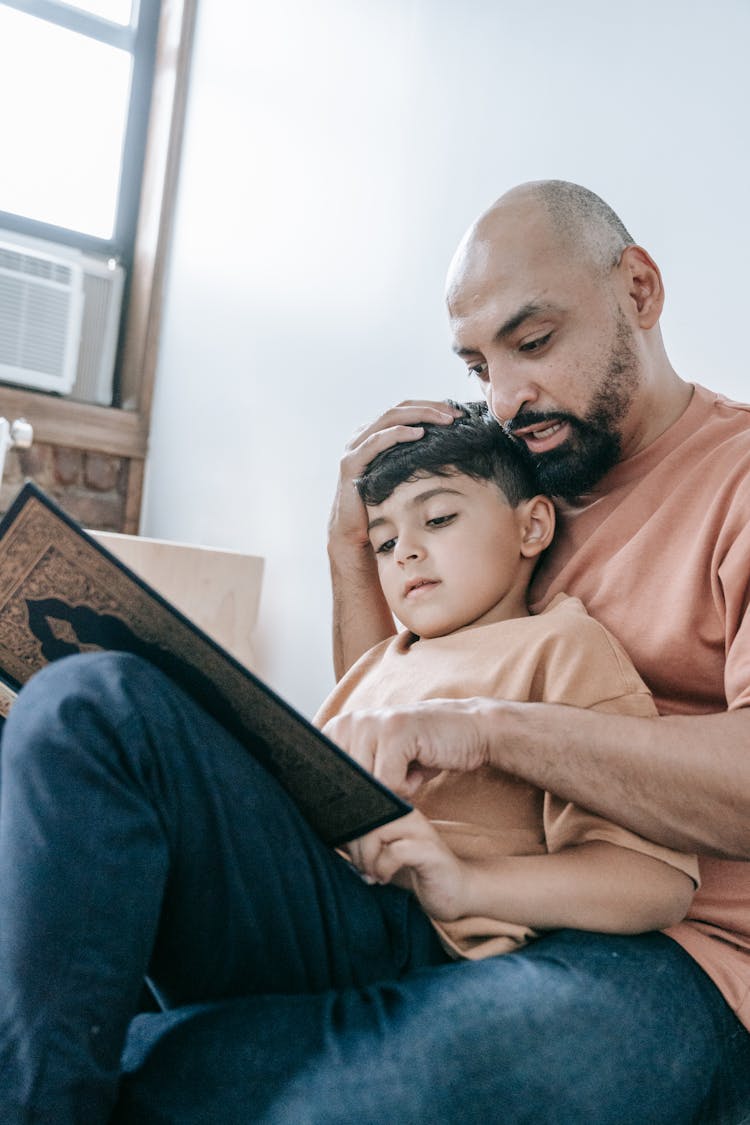 Man In Brown Shirt Hugging A Boy In Brown Shirt