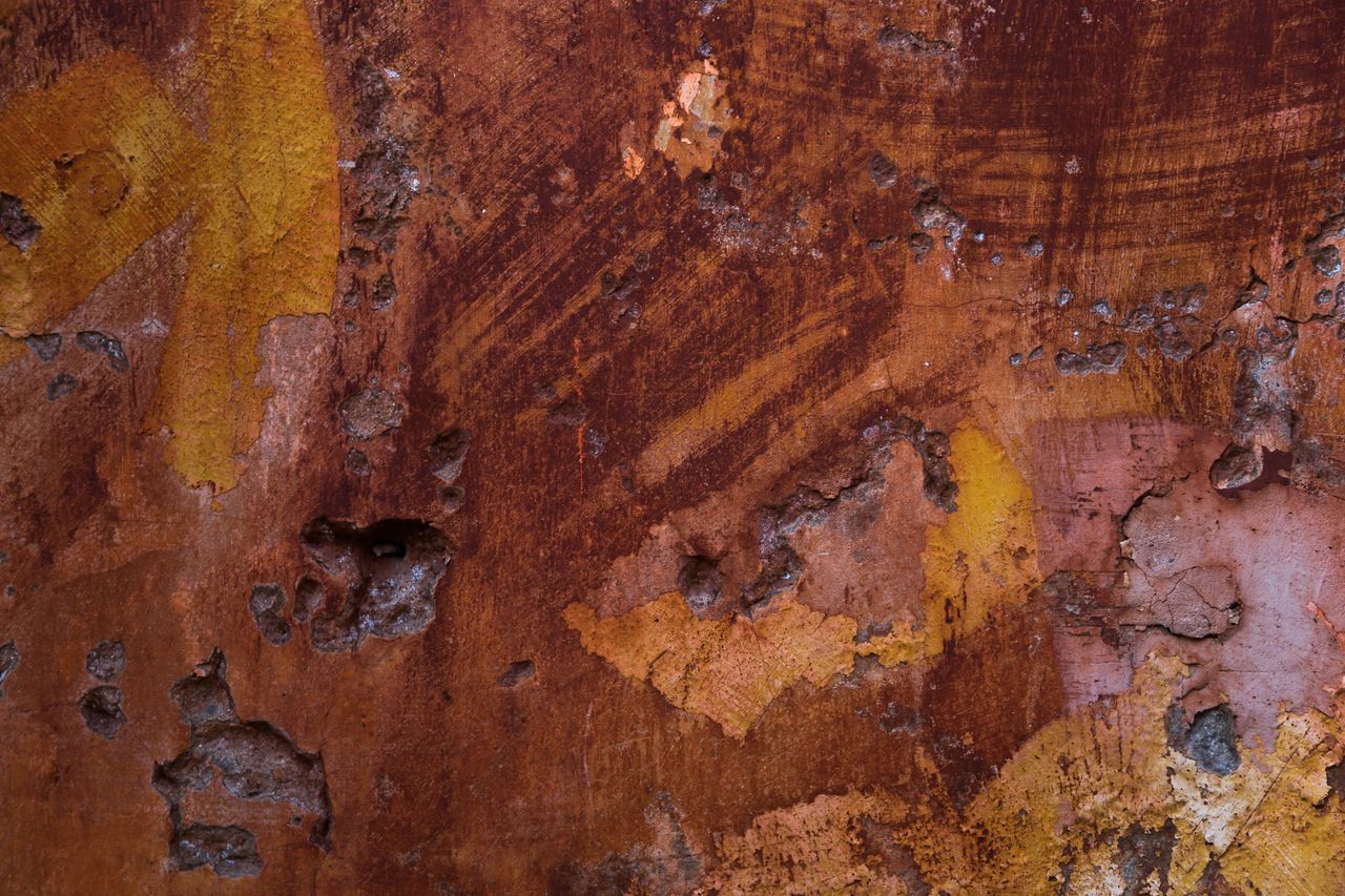 close up of a corroded metal surface showcasing decay and texture