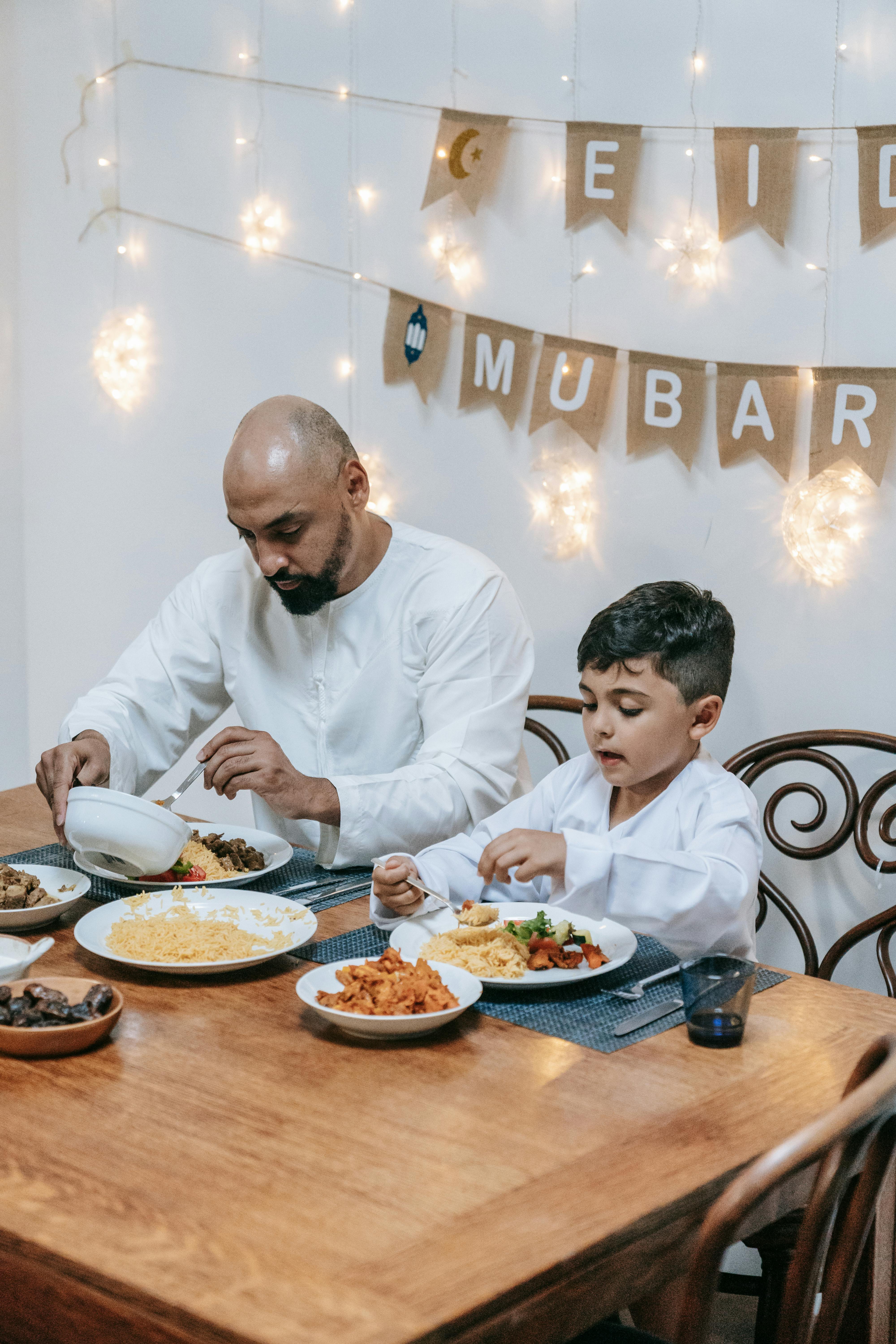 a man eating with his son