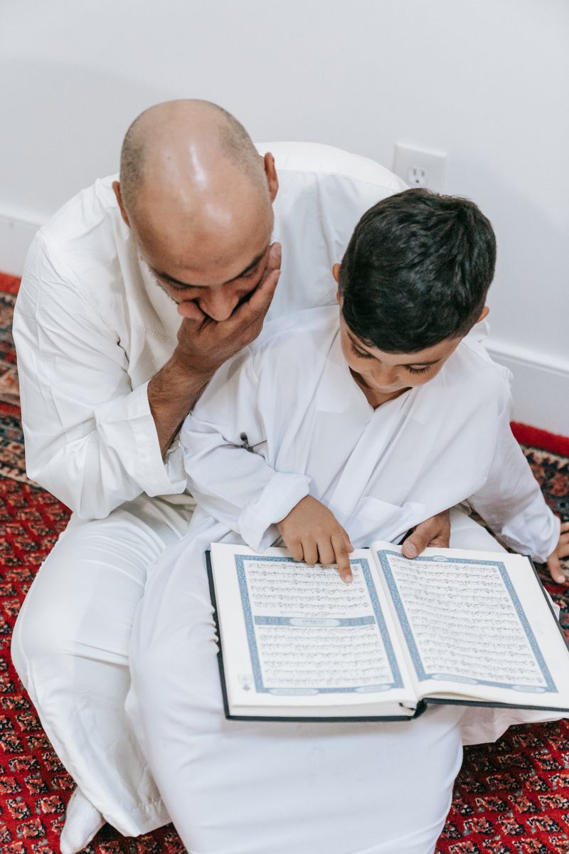 Father and son reading together