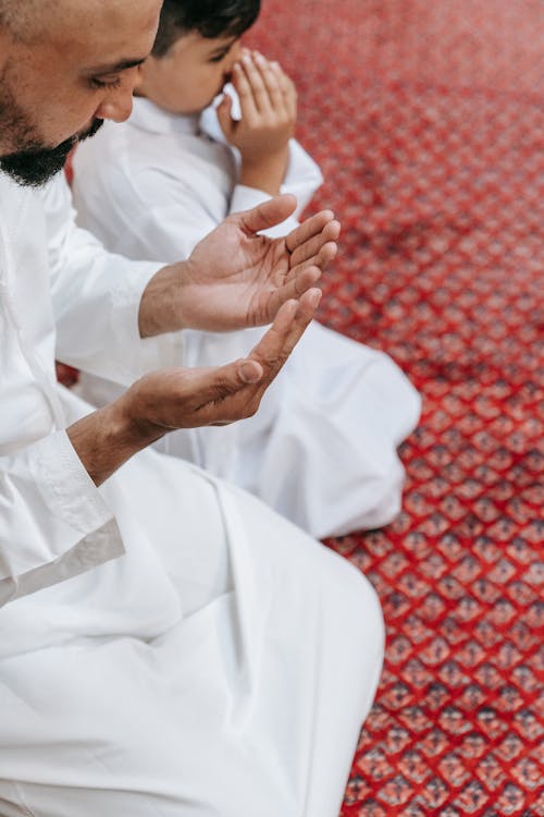 Free Father and Son Kneeling on the Floor Stock Photo