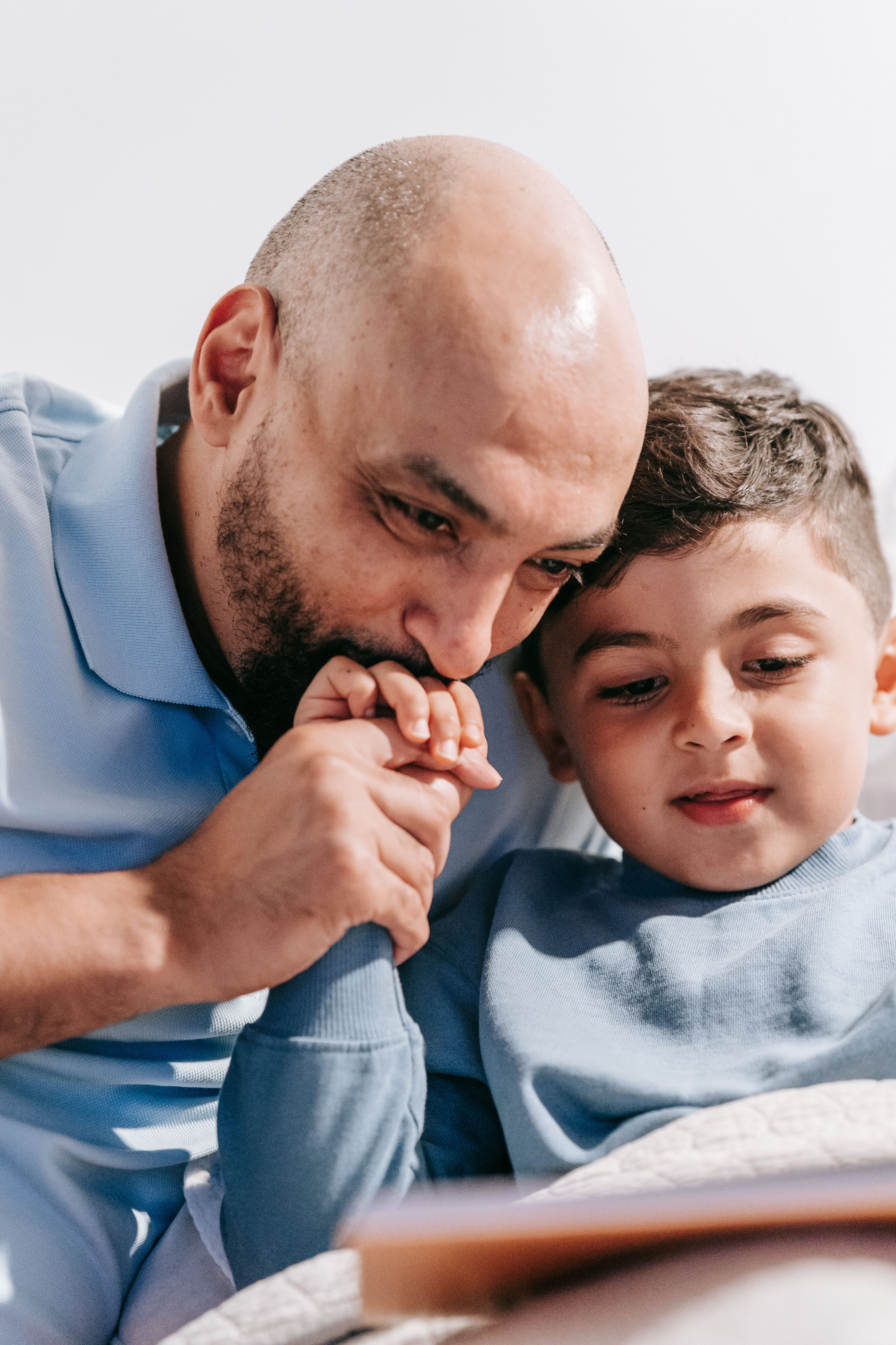 Father reading with young child