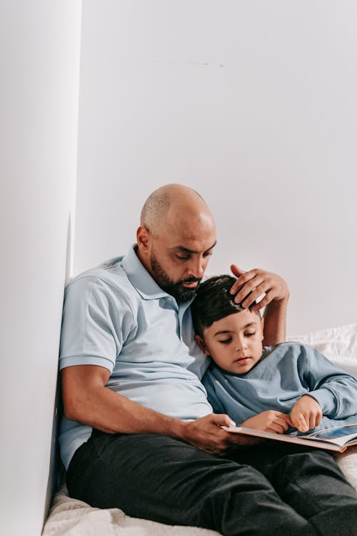 Free Father and Son Reading a Book Stock Photo