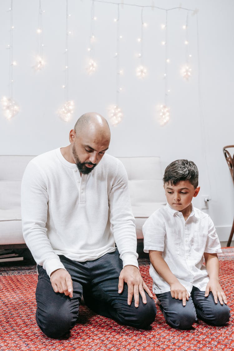 Muslim Father Teaching Son Praying