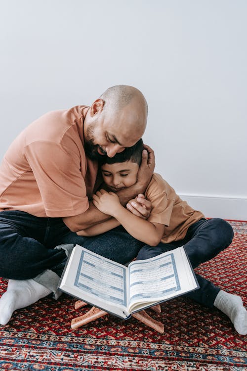 Free Father and Son Sitting on the Floor Stock Photo