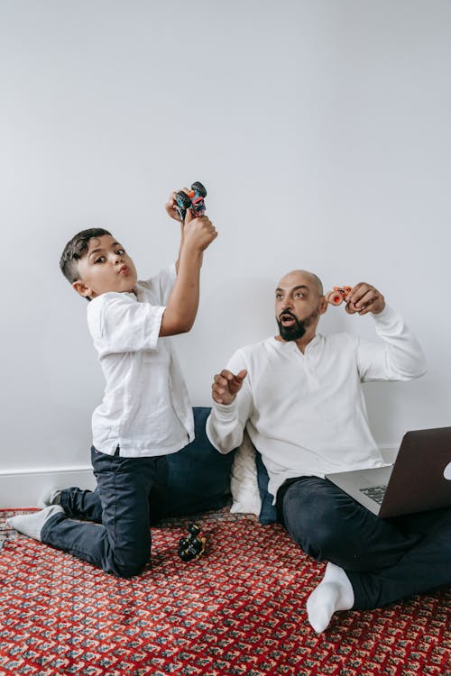 Free Father and Son Playing with Toy Cars Stock Photo