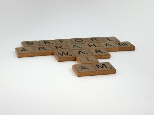 Wooden Scrabble Tiles on White Surface