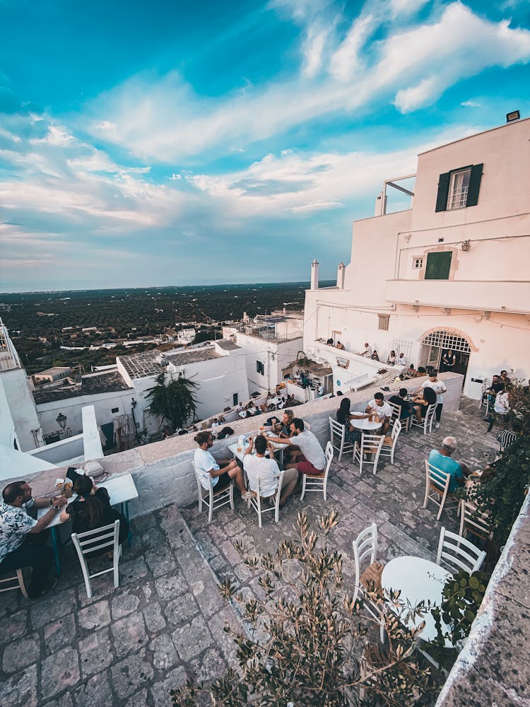 People In Outdoor Restaurant With View