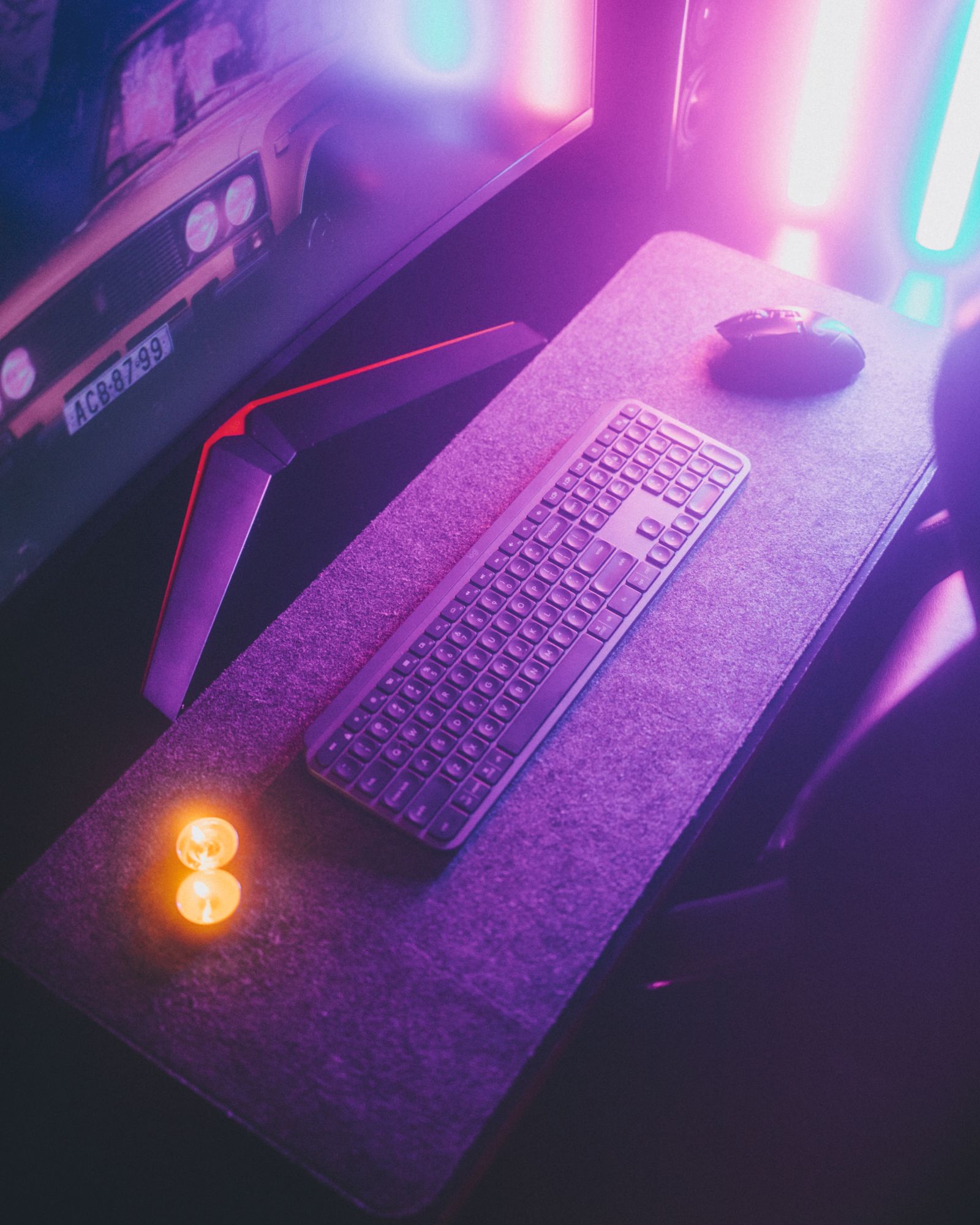 Illuminated gaming keyboard and mouse in a modern technology workspace