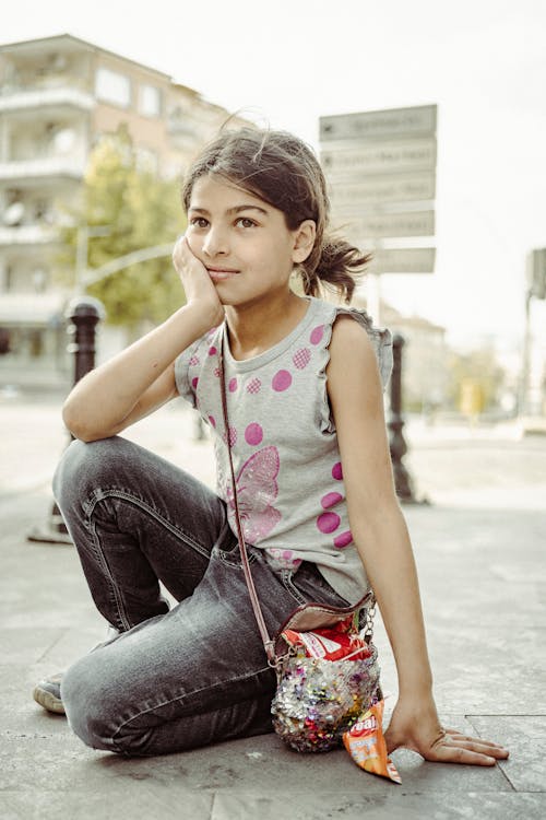 A Girl Sitting on the Floor