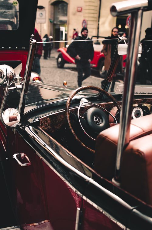 Free Vintage Mercedes Benz convertible in Prague's cobblestone streets, capturing timeless elegance. Stock Photo