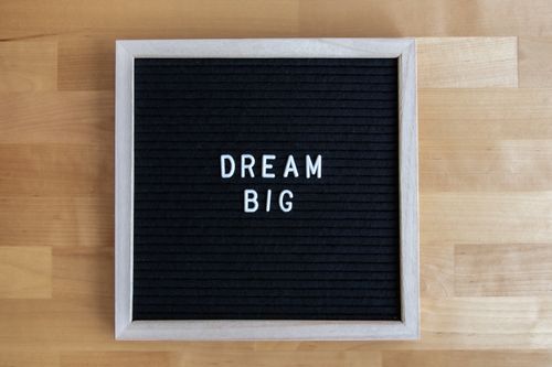 Free A wooden framed black letter board with the inspirational message Dream Big in white letters. Stock Photo