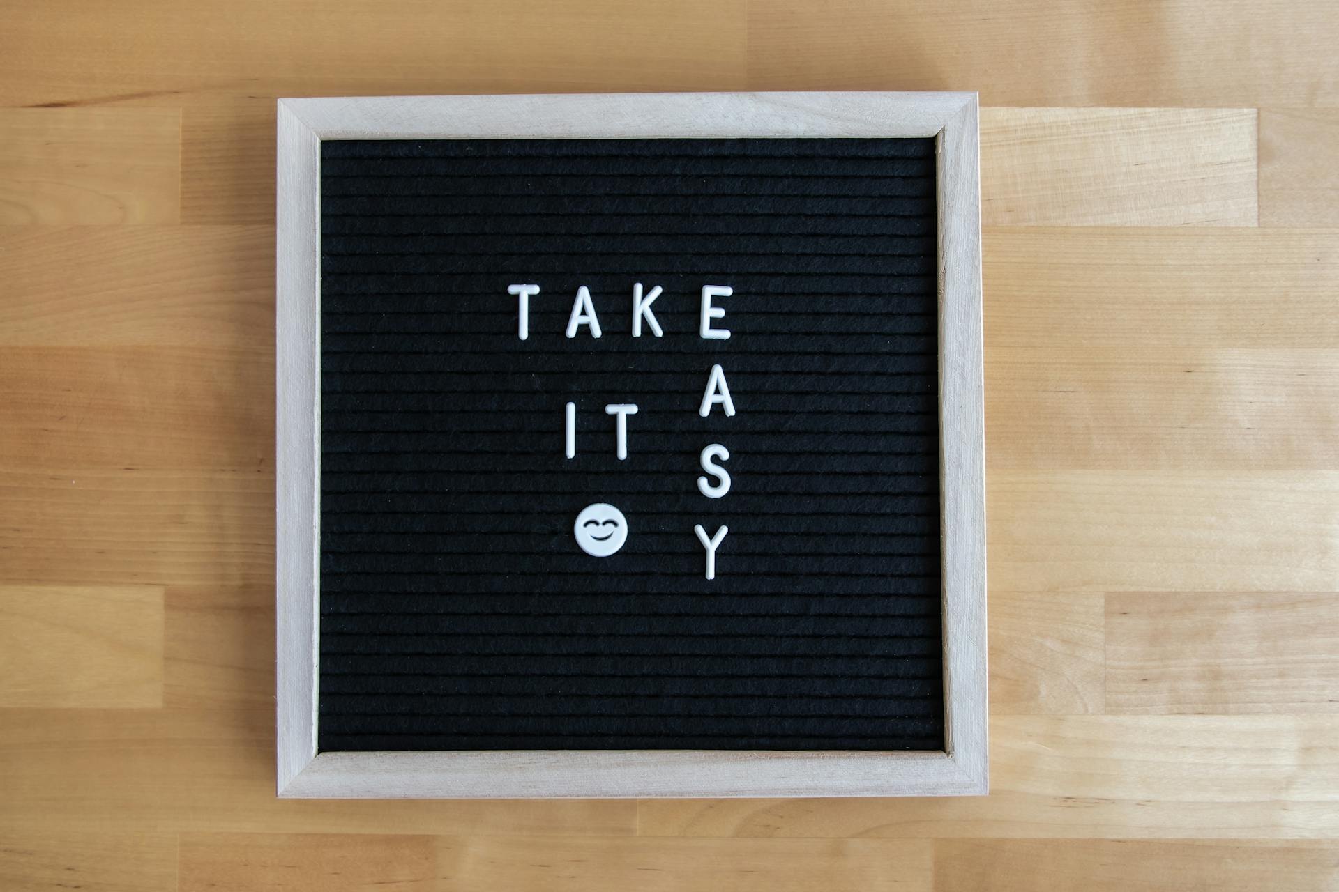 Letter board displaying 'Take it easy' message with a smiley face for positive vibes.