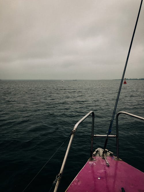 The Front of a Sailing Boat and an Open Sea 