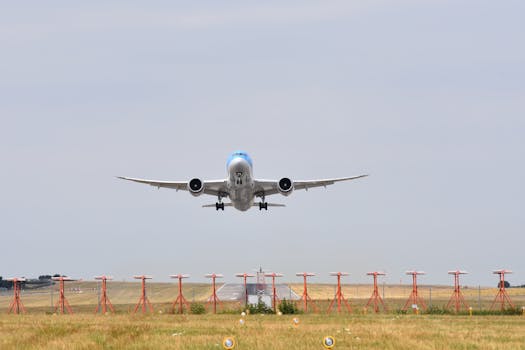 Wide-body airplane taking off from a runway, showcasing aviation and travel themes.