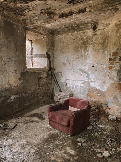 Free Sofa Chair Inside an Abandoned House Stock Photo