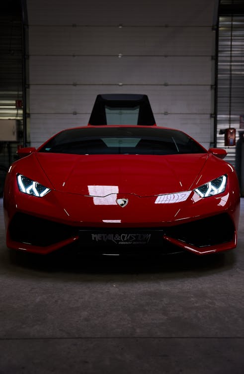 Free Red Lamborghini Parked in a Garage Stock Photo
