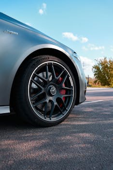 Detailed shot of a luxury car wheel highlighting the rim and tire design.