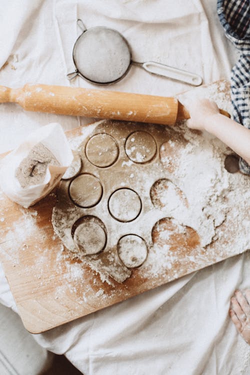 Hands of a Person Preparing Dough