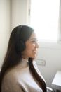 Woman in White Tank Top Wearing Black Headphones