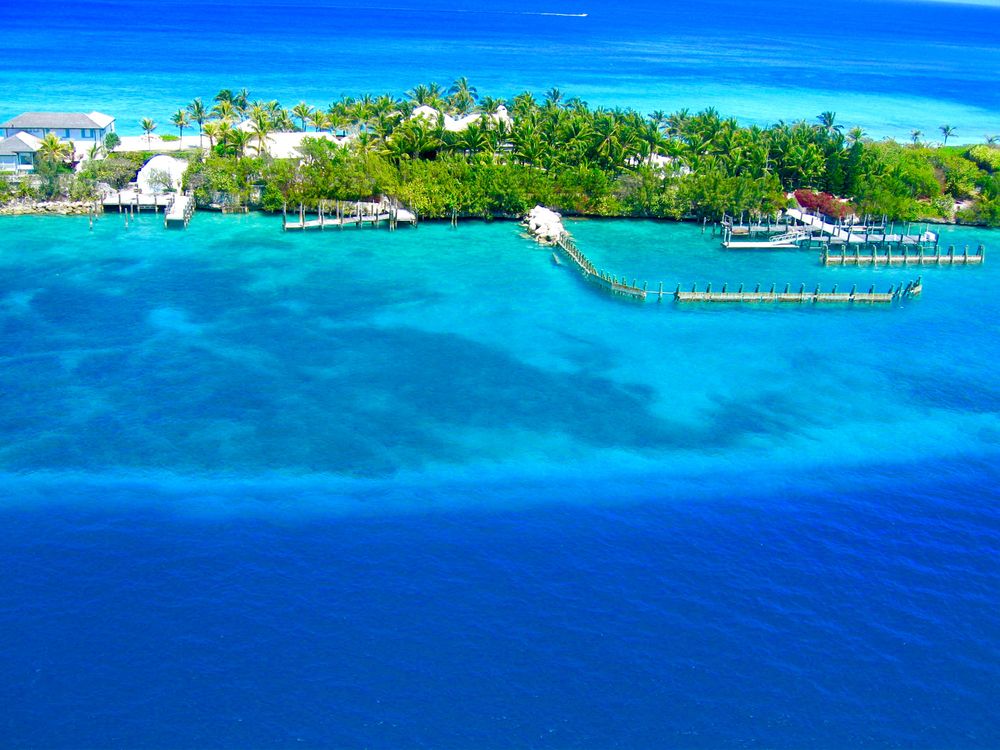 Turquoise ocean surrounding an island in the Bahamas