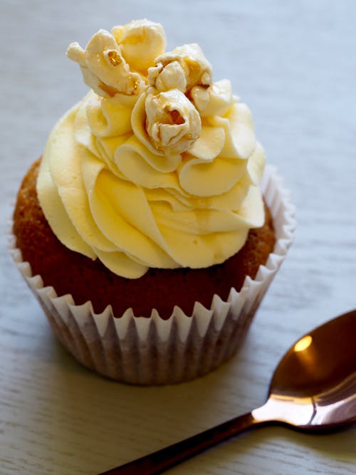 Free Cupcake With Yellow Icing On Top Stock Photo