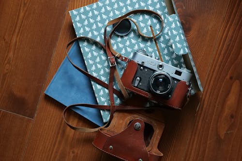 An Analog Camera on a Wooden Surface