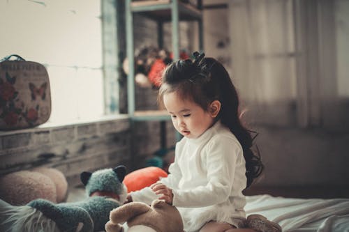 Free Photography of a Baby Girl Playing  Stock Photo
