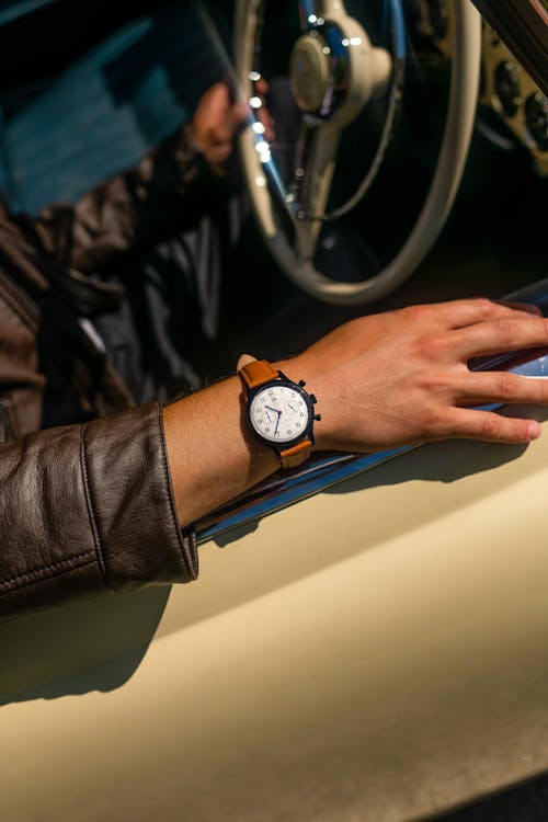 Person Wearing Brown Analog Watch