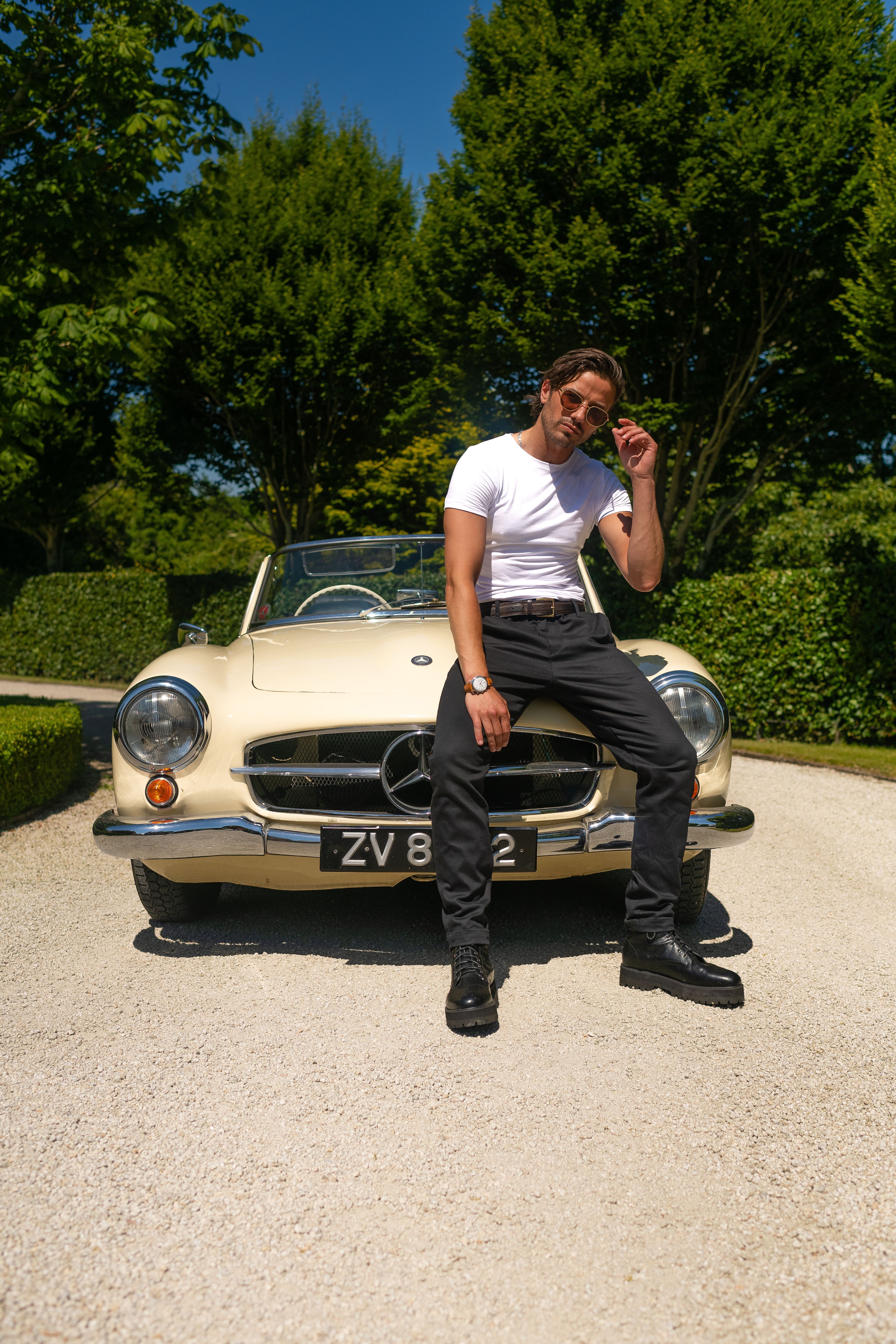 Man Sitting on the Car · Free Stock Photo