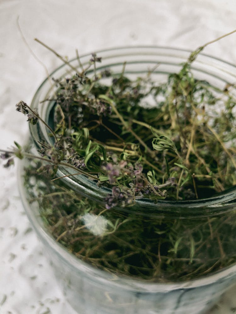 Dried Herbs In Glass Jar