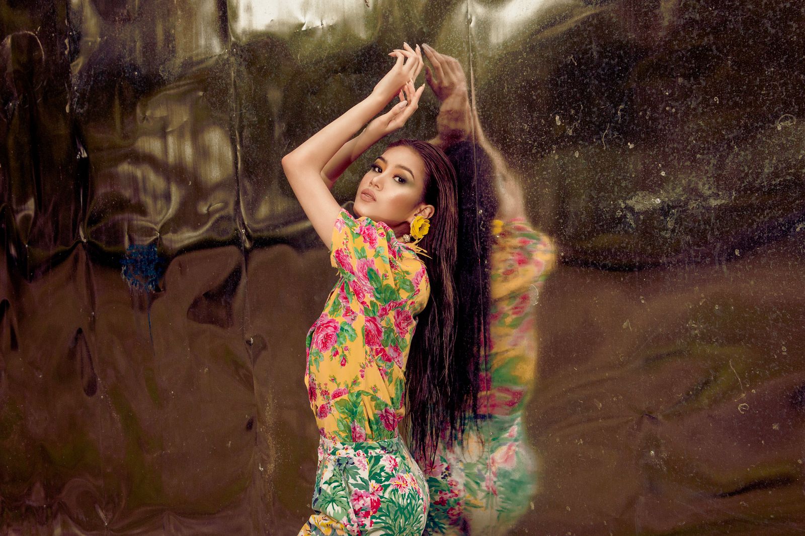 A woman in a bold colorful floral print, why tropical florals are summer's boldest print