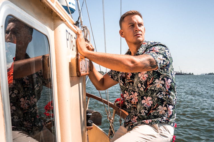 Man Aboard A Sailing Boat 