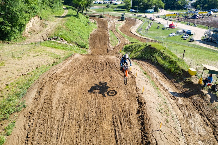 A Person Biking On A Muddy Trail