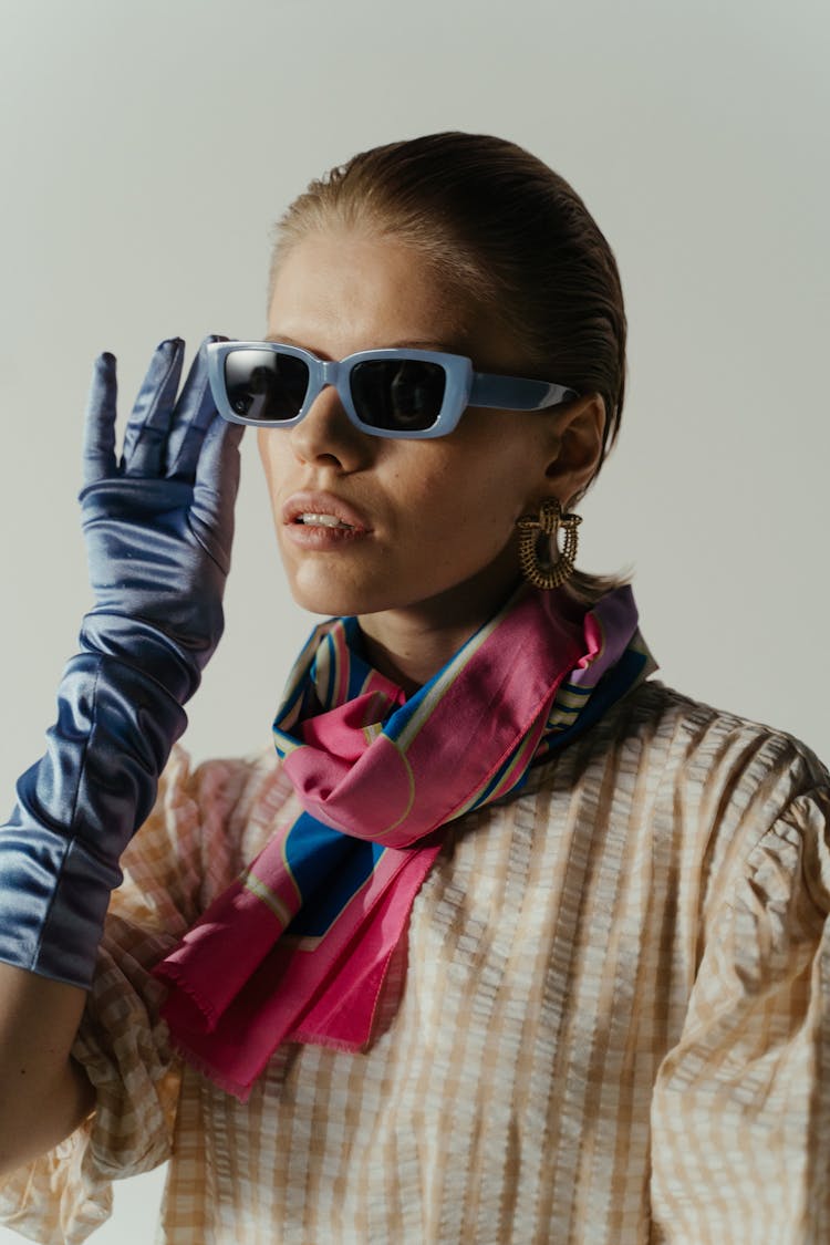 Woman Wearing Purple Framed Sunglasses With Pink Scarf