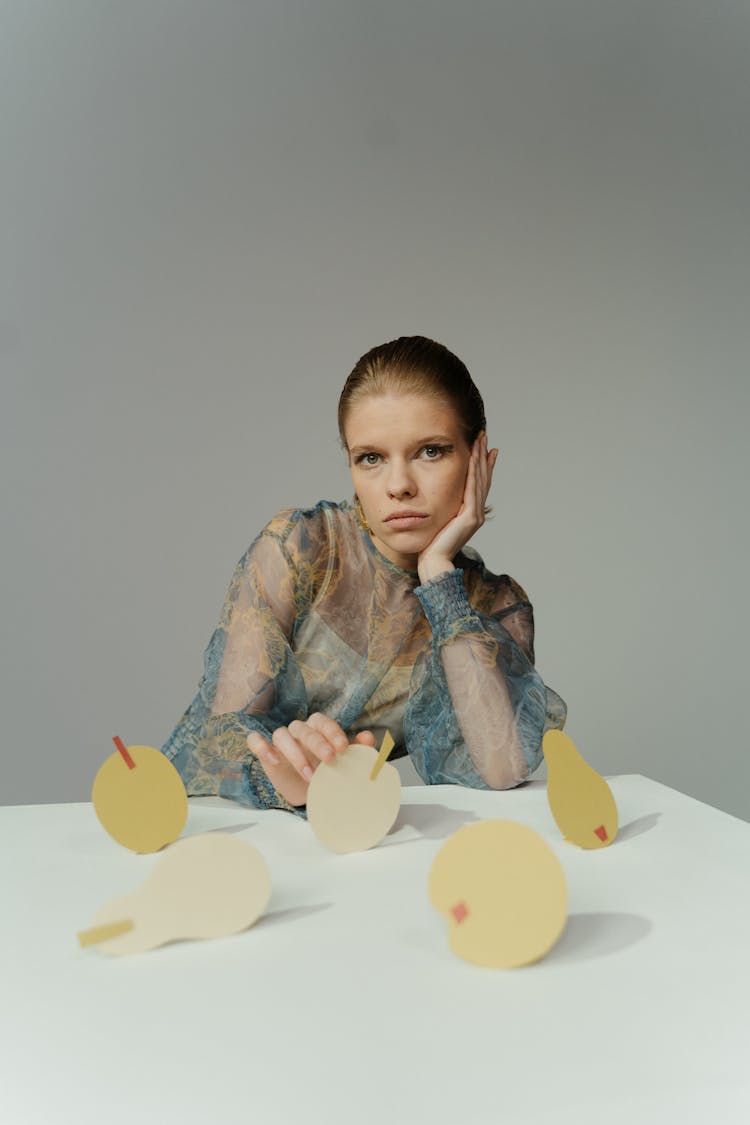 A Woman Sitting At The Table